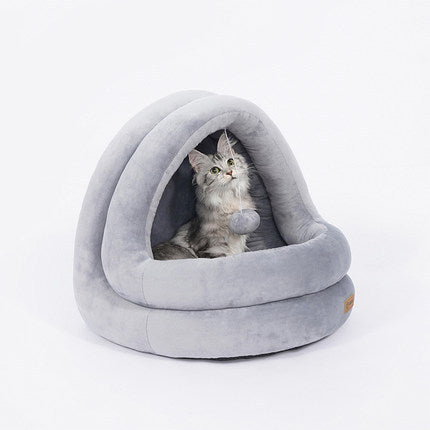 Cat in grey cat bed.